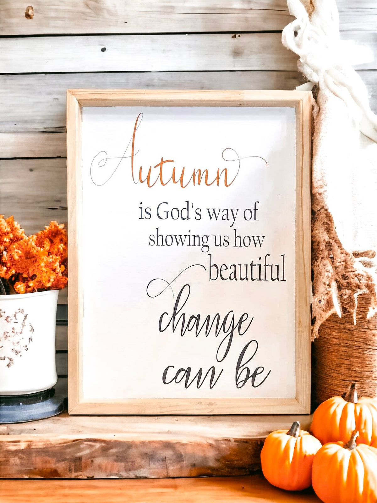 Autumn is Gods Way framed wood sign with copper and black lettering in whitewashed birch frame on white mantel with orange pumpkins and fall flowers hero shot