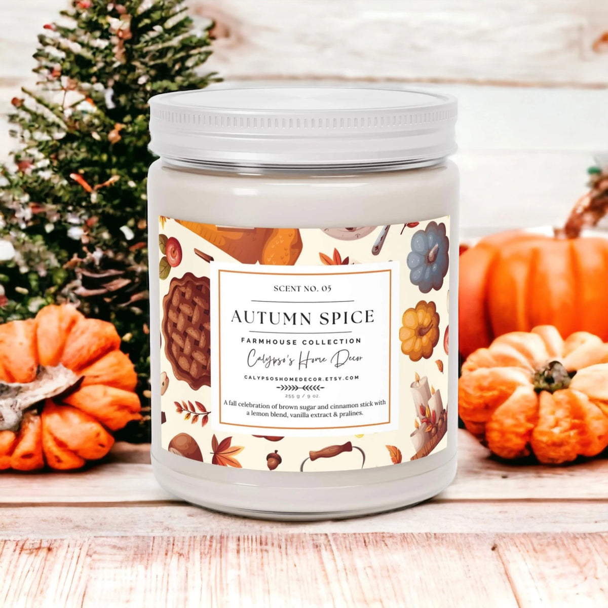 Autumn Spice candle on rustic wood with pumpkins in background