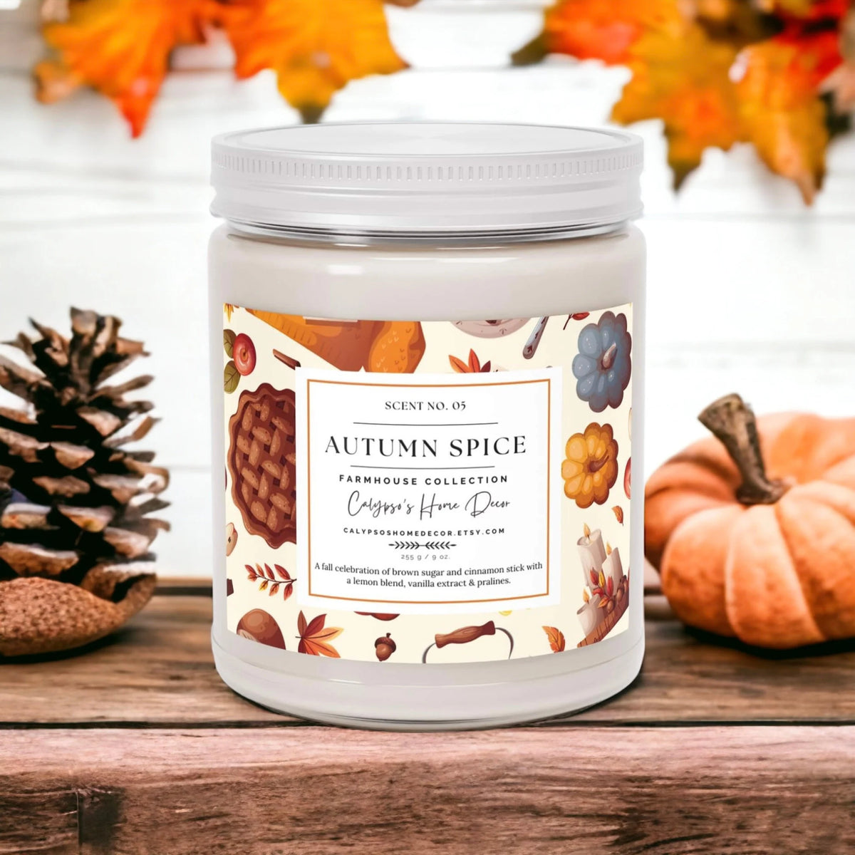 Autumn Spice candle with spices and cinnamon sticks on wood table