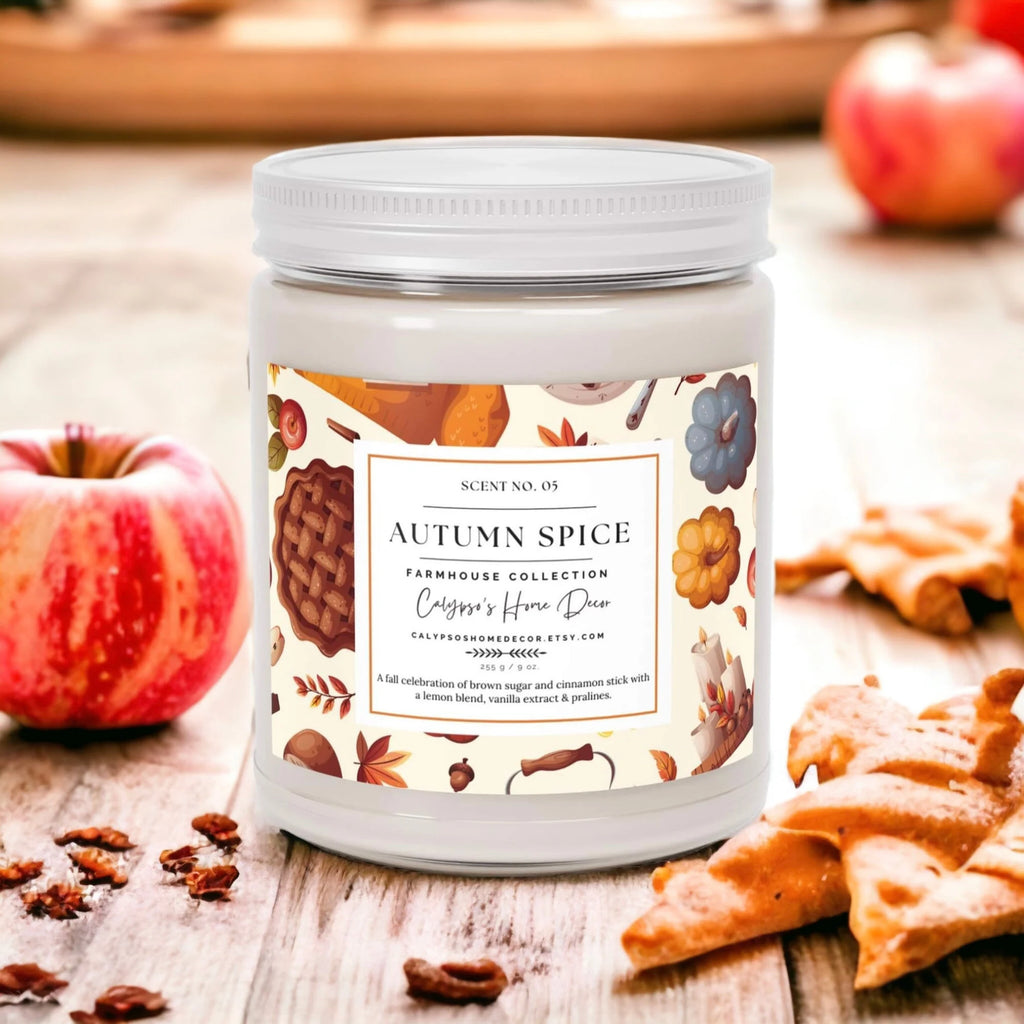 Autumn Spice candle with pumpkins and cinnamon sticks on white background