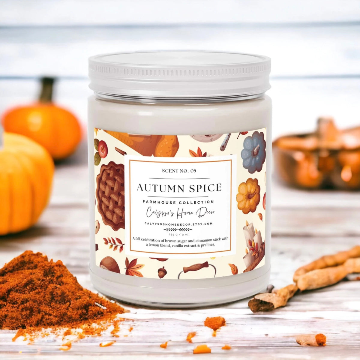 Autumn Spice candle with autumn leaves and apple on white wood
