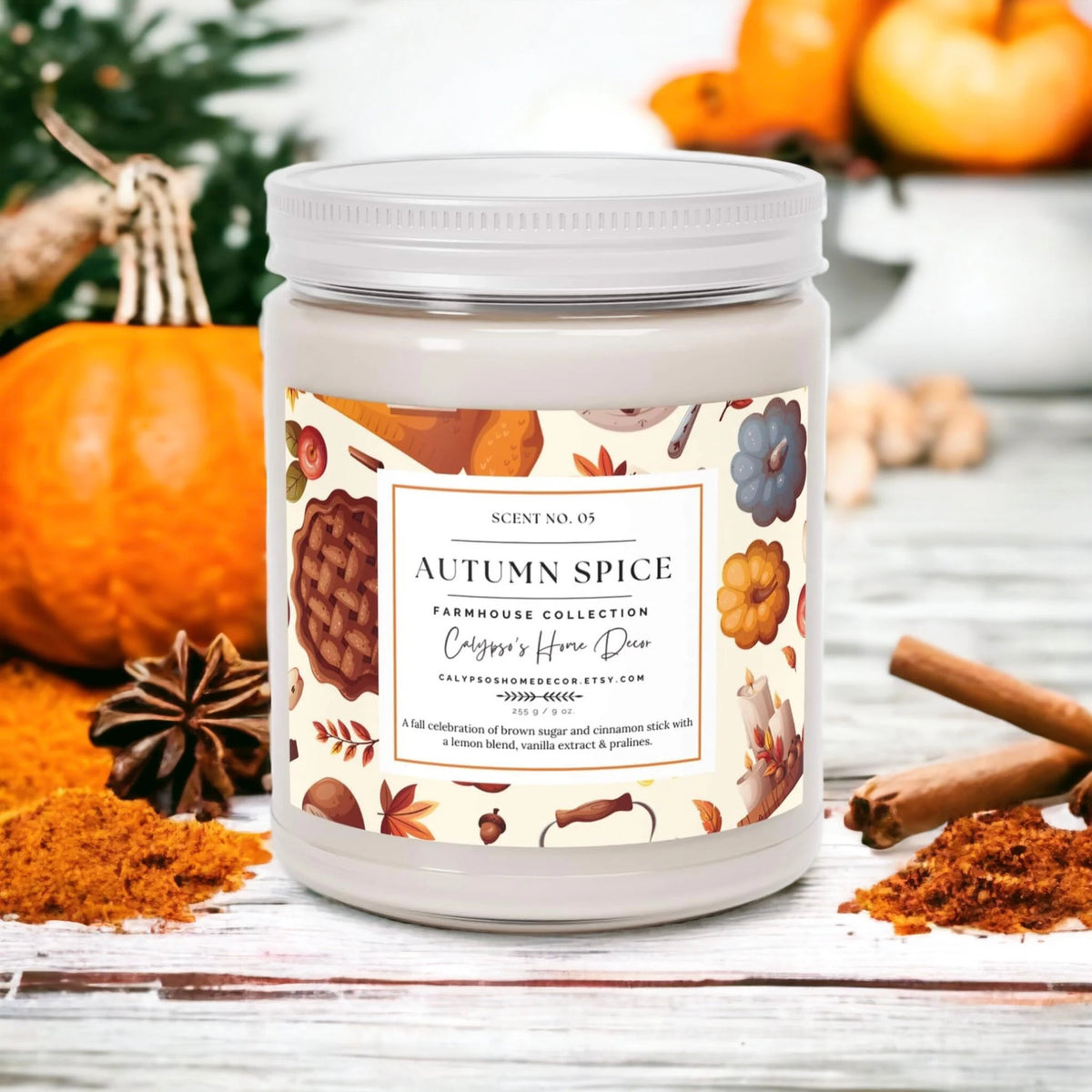 Autumn Spice candle with apple pie and pecans on wood surface