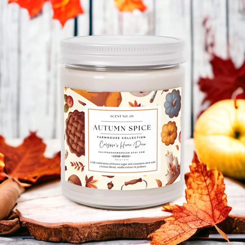 Autumn Spice candle on wood slice with pumpkins and fall leaves