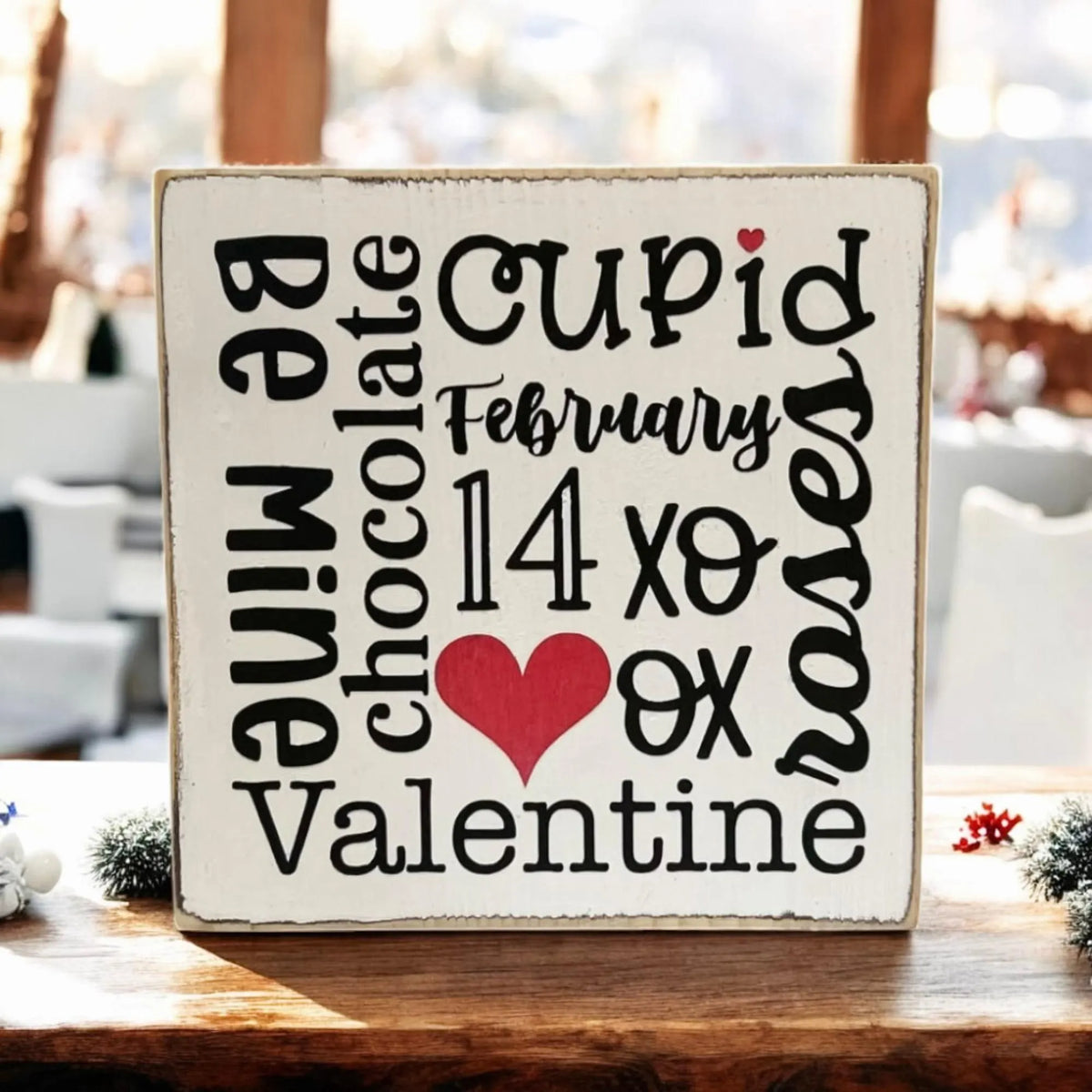 Valentine sayings wood block on rustic wood with pink and cream mixed floral arrangement