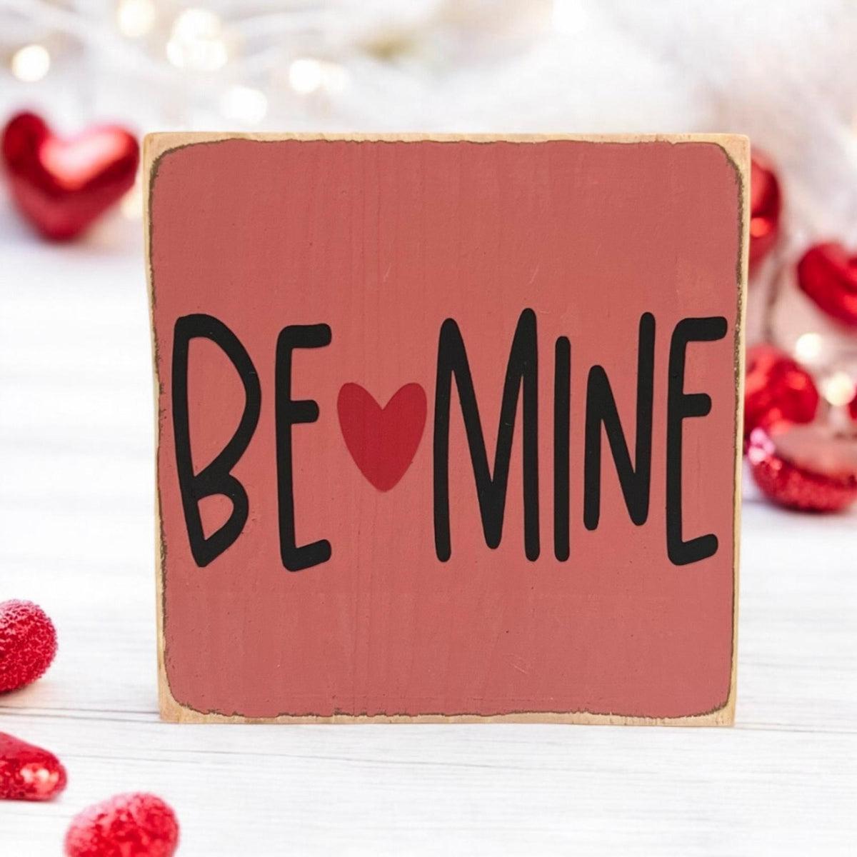 Be Mine Valentine wood block sign on white wood surface with red roses full view