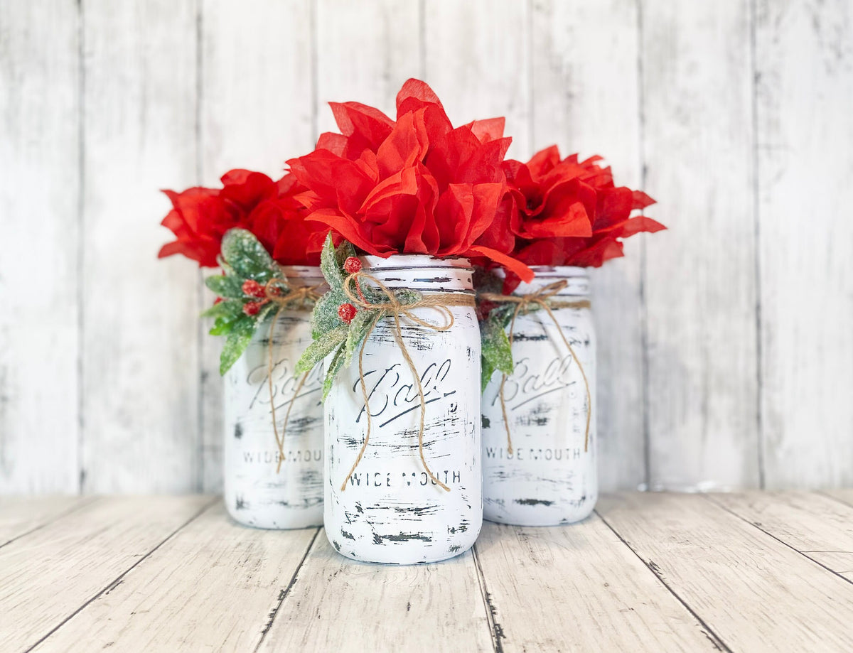 Farmhouse Christmas mason jar centerpiece set on white wood surface
