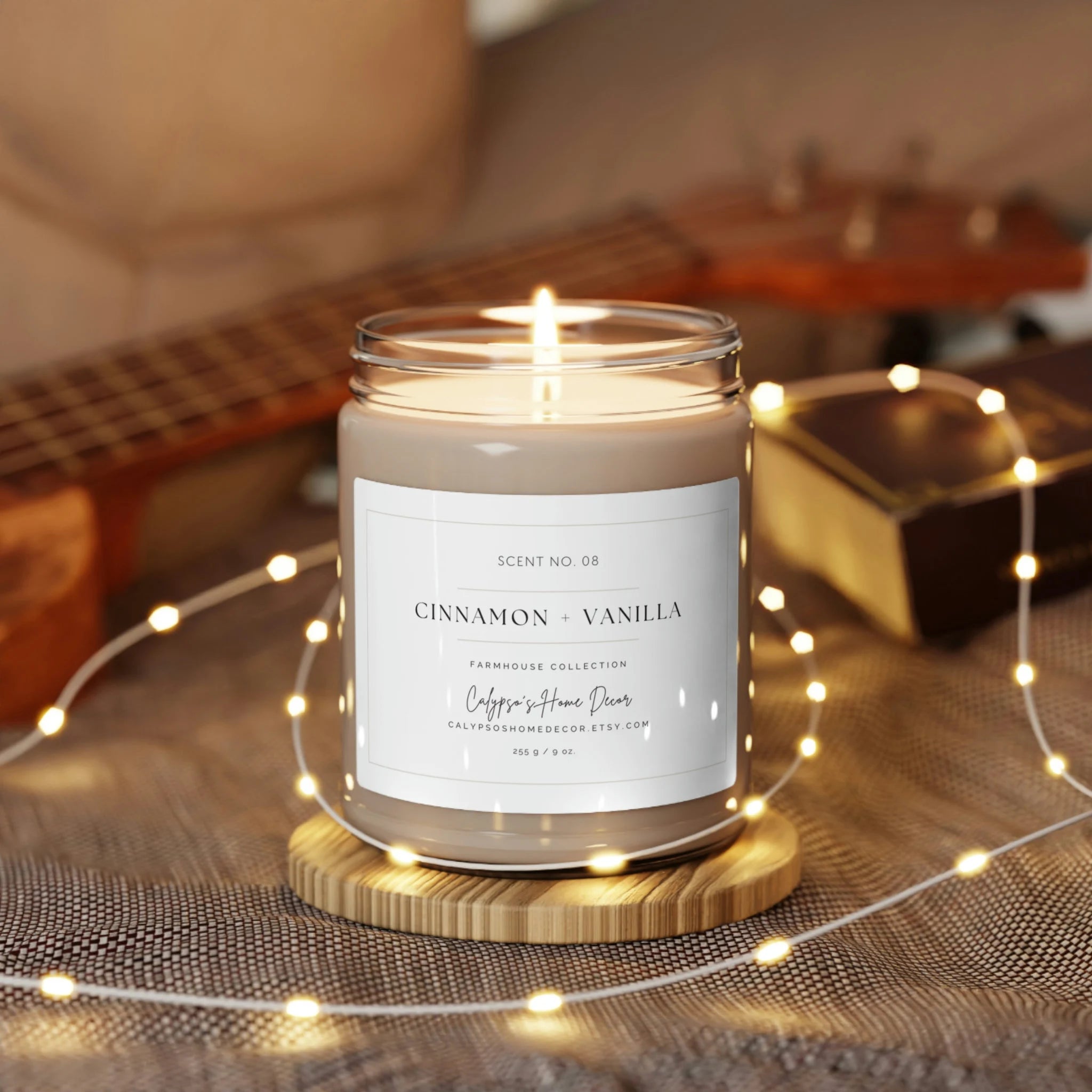 Cinnamon Vanilla candle lit surrounded by fairy lights