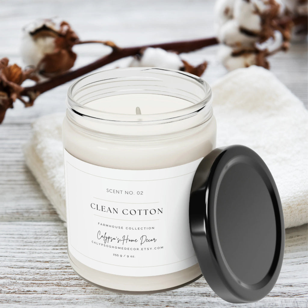 Clean Cotton soy candle Scent No. 02 Farmhouse Collection glowing on wood coaster surrounded by fairy lights