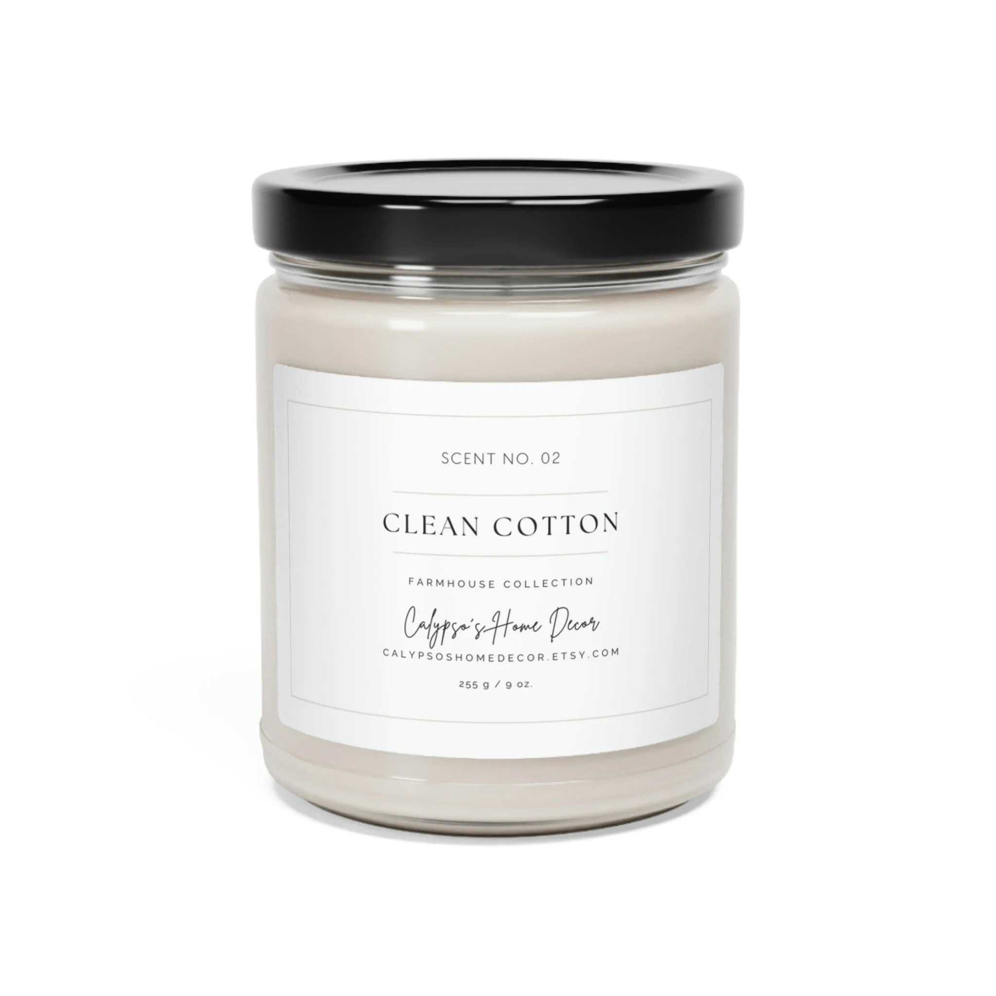 Clean Cotton soy candle Scent No. 02 Farmhouse Collection on white wood surface with cotton stems and white linen