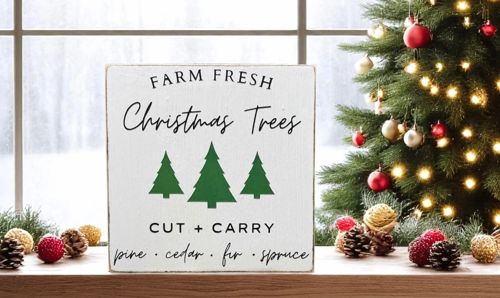 Farm Fresh Christmas Trees wood block sign in wooden tray with red ornaments and pine sprigs