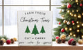 Farm Fresh Christmas Trees wood block sign in wooden tray with red ornaments and pine sprigs