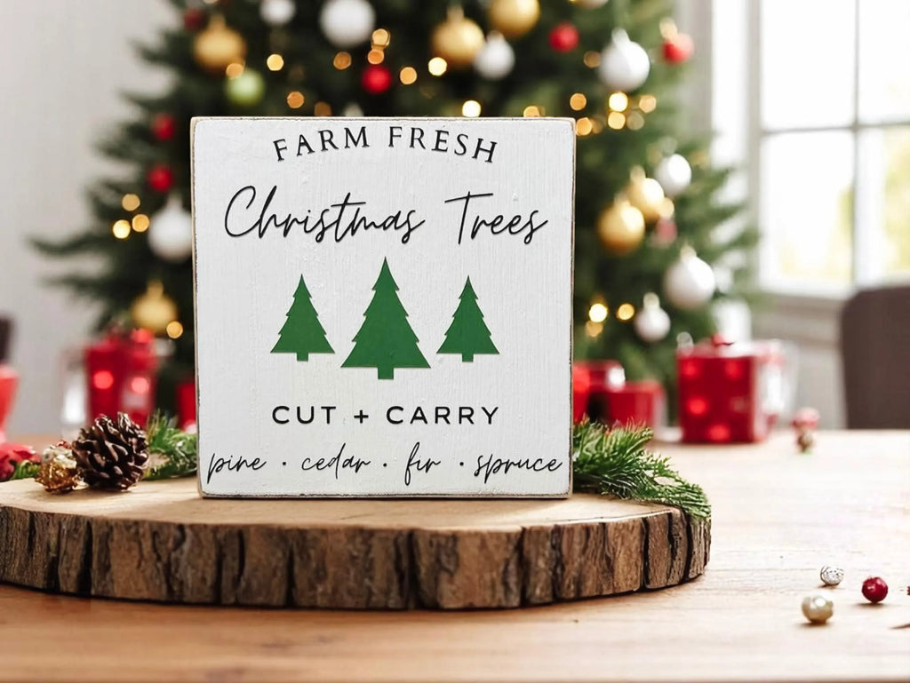 Farm Fresh Christmas Trees wood block sign close up showing tree design and pine cedar fir spruce lettering