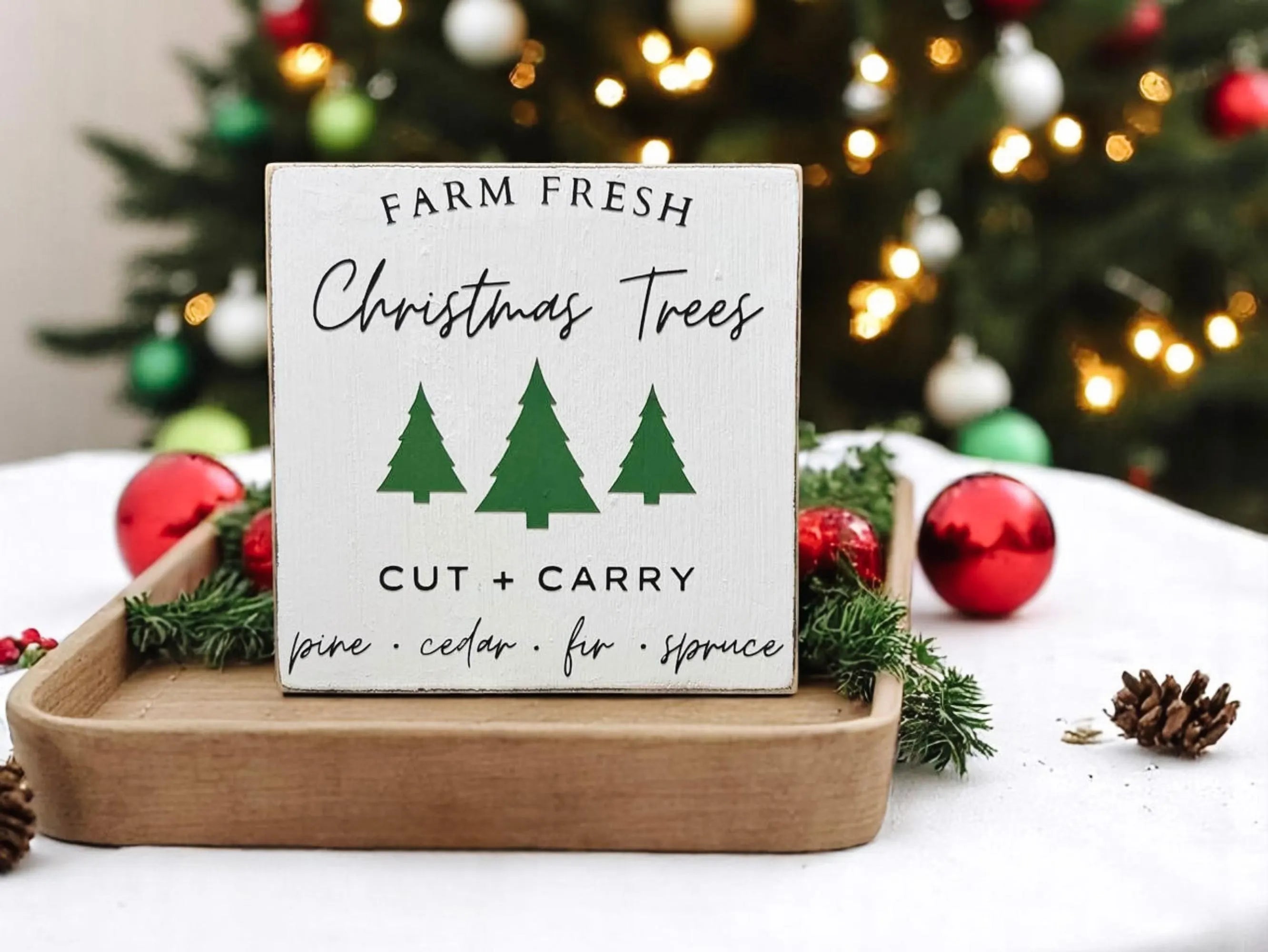 Farm Fresh Christmas Trees wood block sign in wooden tray with red ornament and holly berries