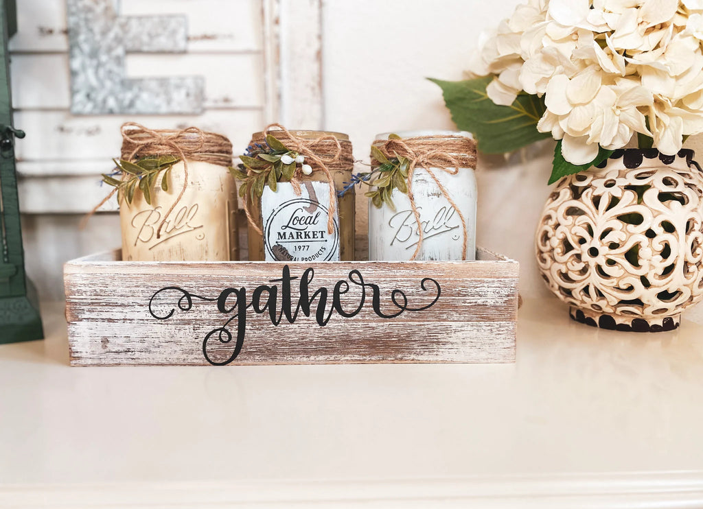 Farmhouse mason jars in dark walnut Gather tray on wood table close-up with gold jar