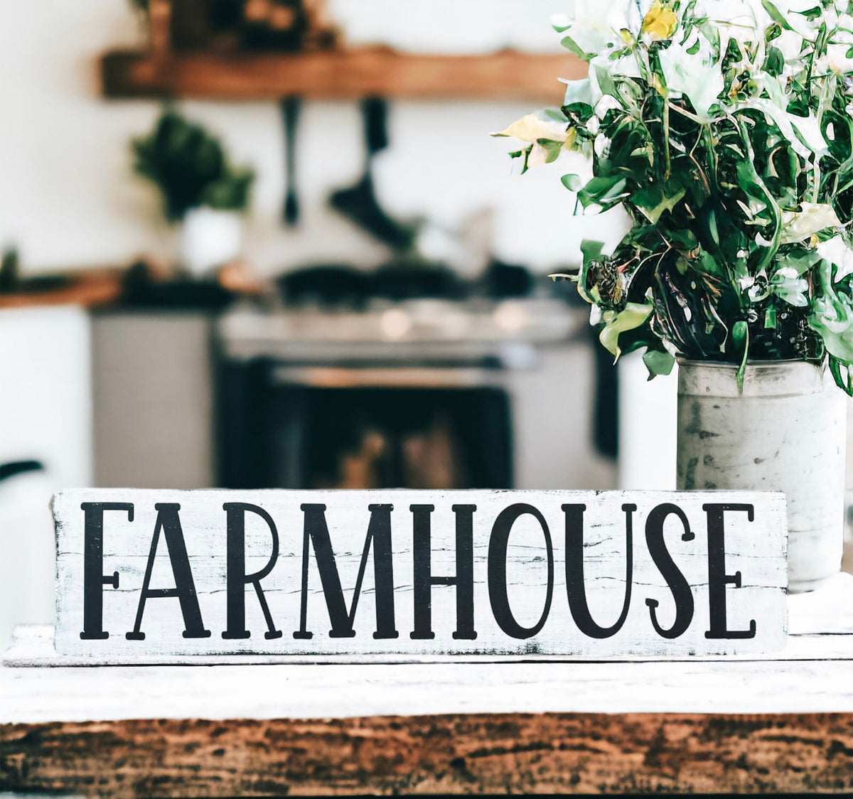 Farmhouse sign on white brick wall above kitchen counter