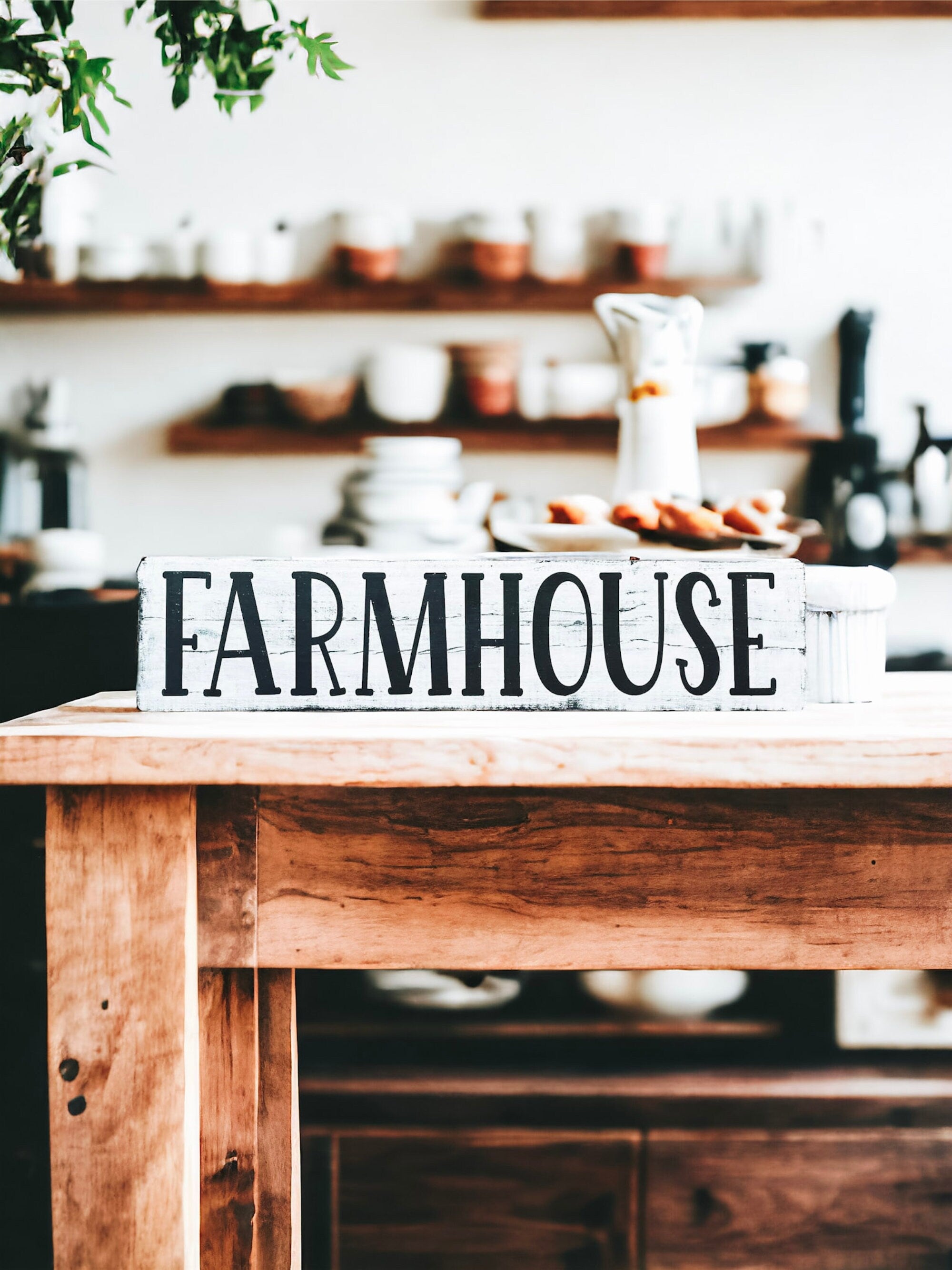 Farmhouse sign propped on wooden table with wicker basket