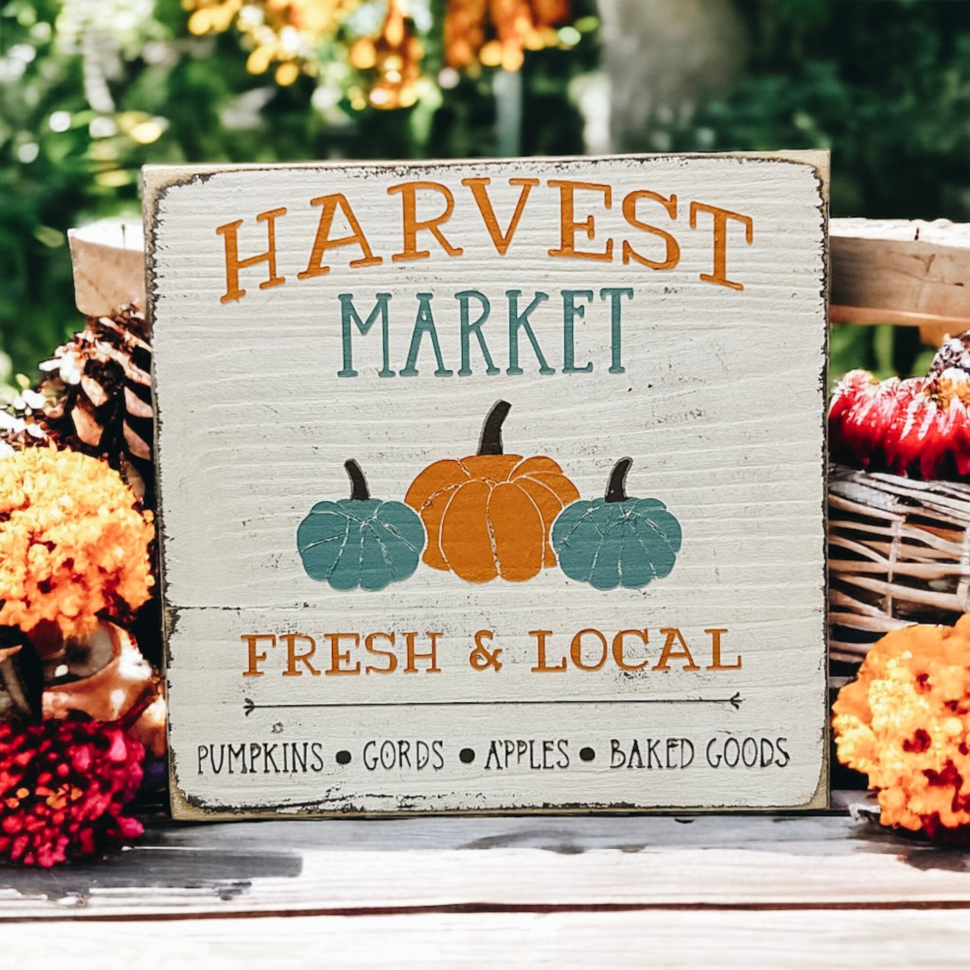 Harvest Market 5x5 wood sign with orange and teal pumpkins on rustic wood surface