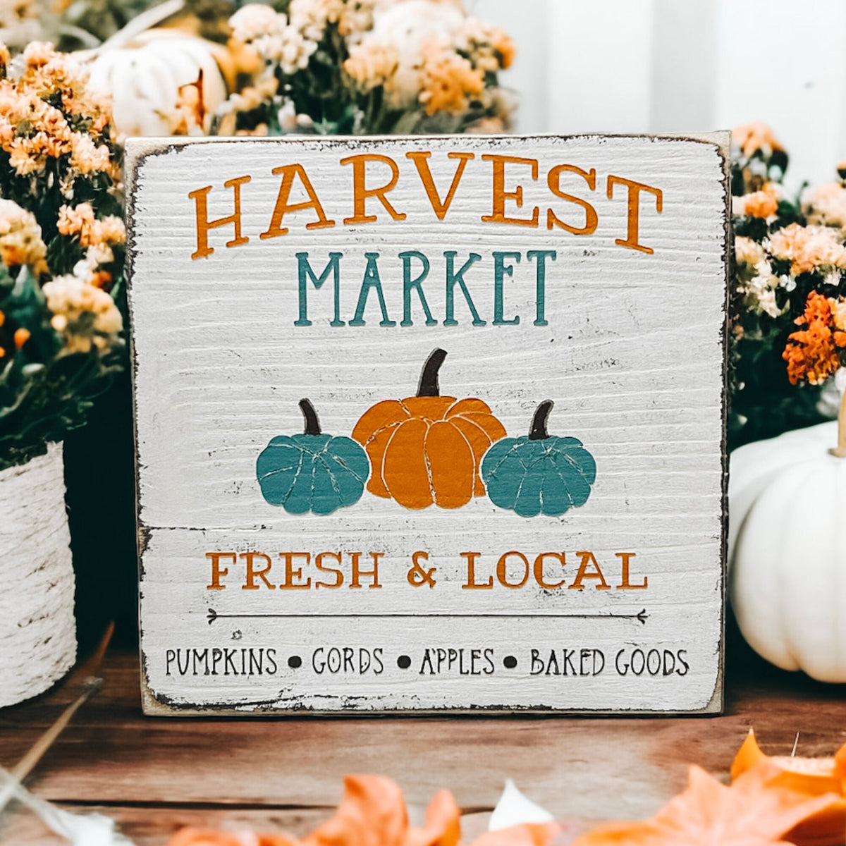 Harvest Market sign between jute rope balls on wood shelf