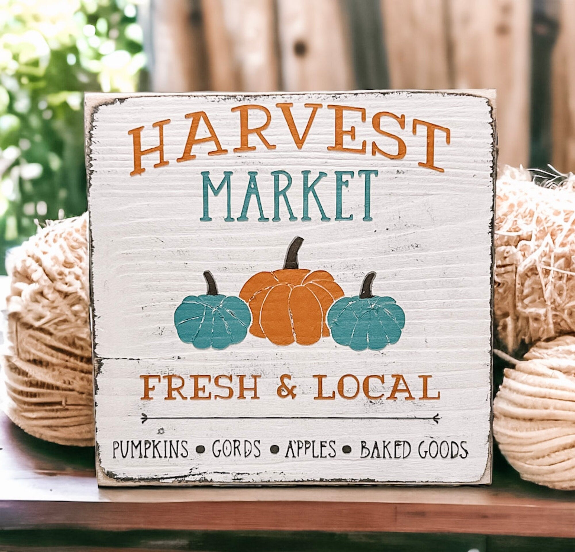Harvest Market sign front view on weathered wood