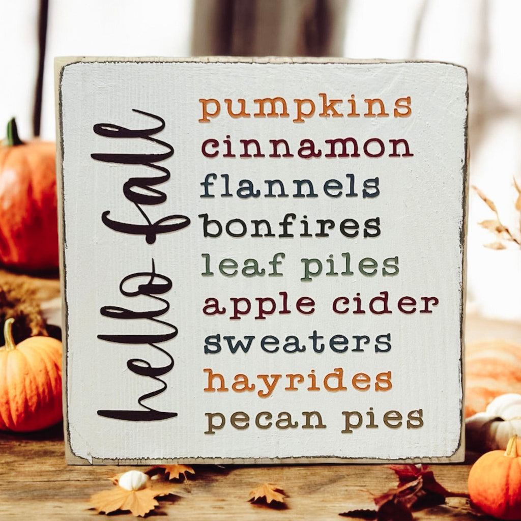 Hello Fall Favorites wood sign on wooden surface
