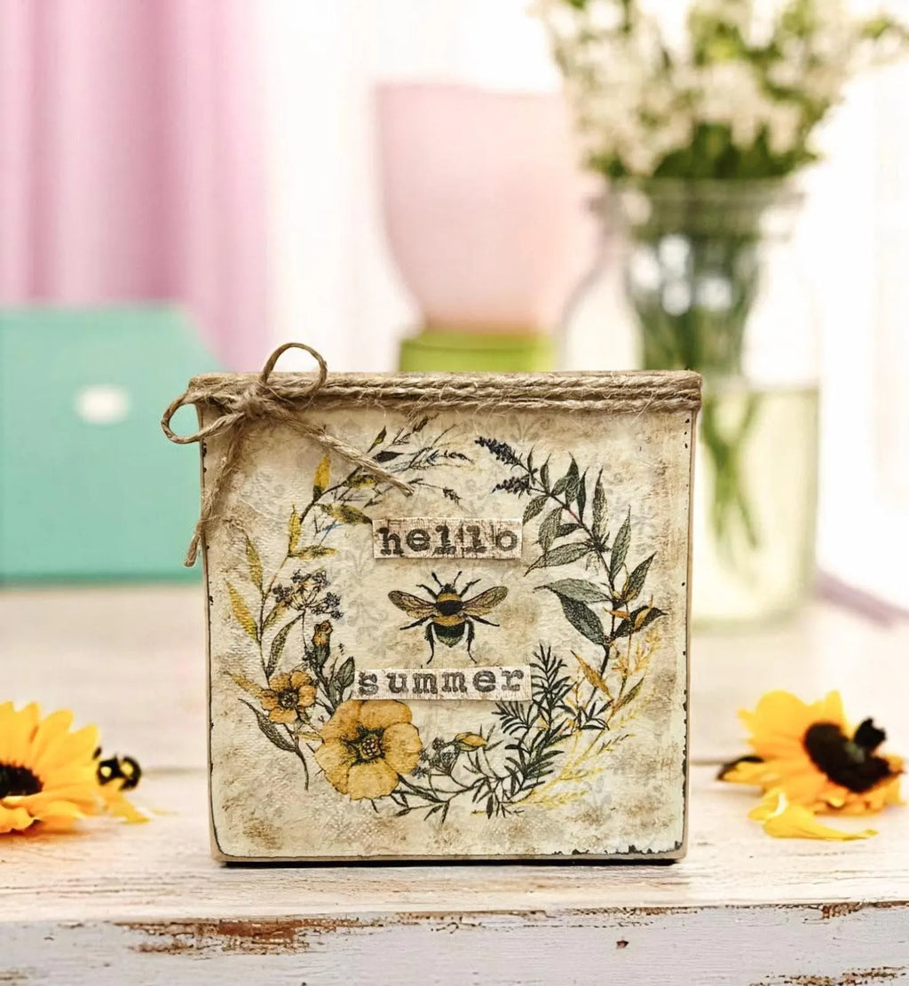 Hello Summer bee sign front view on distressed white wood with sunflowers