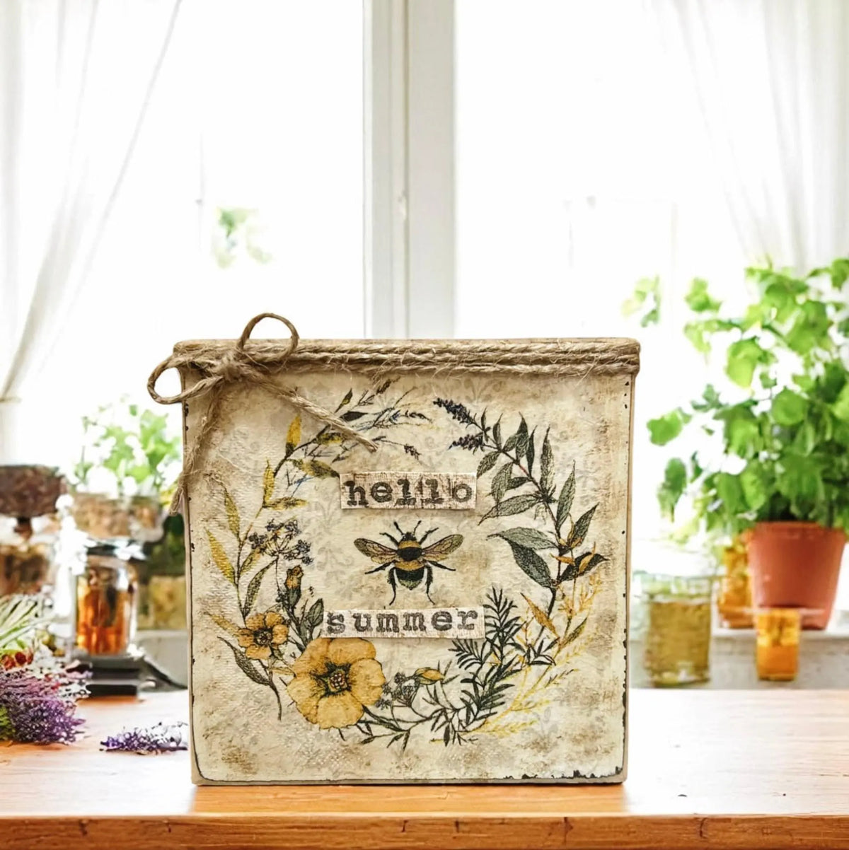 Hello Summer bee sign on wood slice with teal lantern and sunflower vase