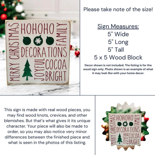 Christmas sayings wood block sign with HoHoHo Merry Christmas Family Decorations Joyful Cocoa Bright in red and green on distressed white pine on rustic wood surface with gold and red ornaments and pine bokeh hero shot