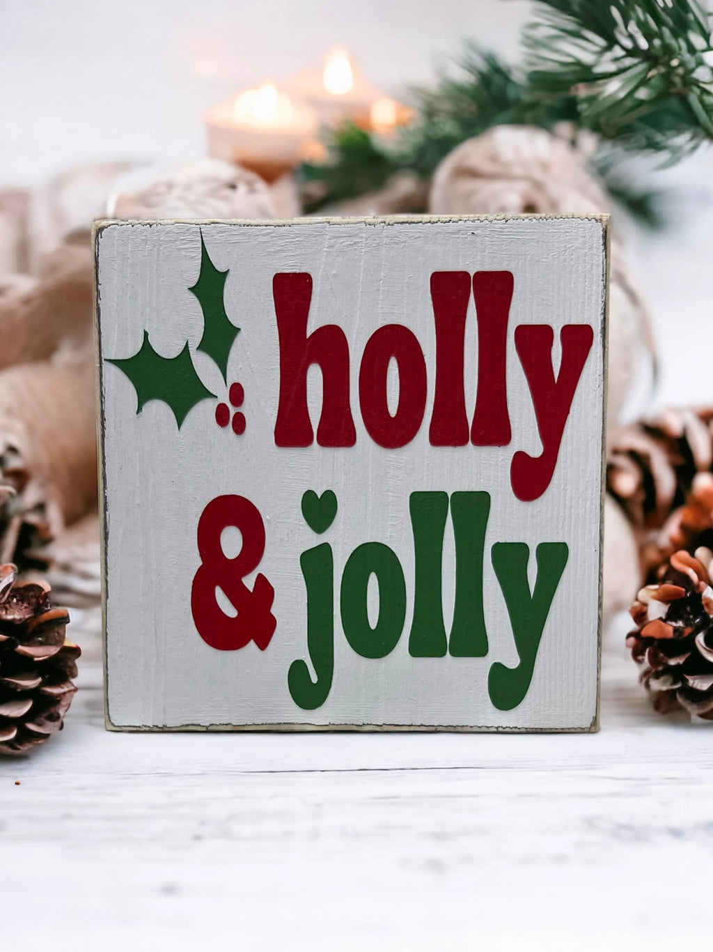Holly & Jolly wood sign on gold tray with silver tinsel and red glitter ornament