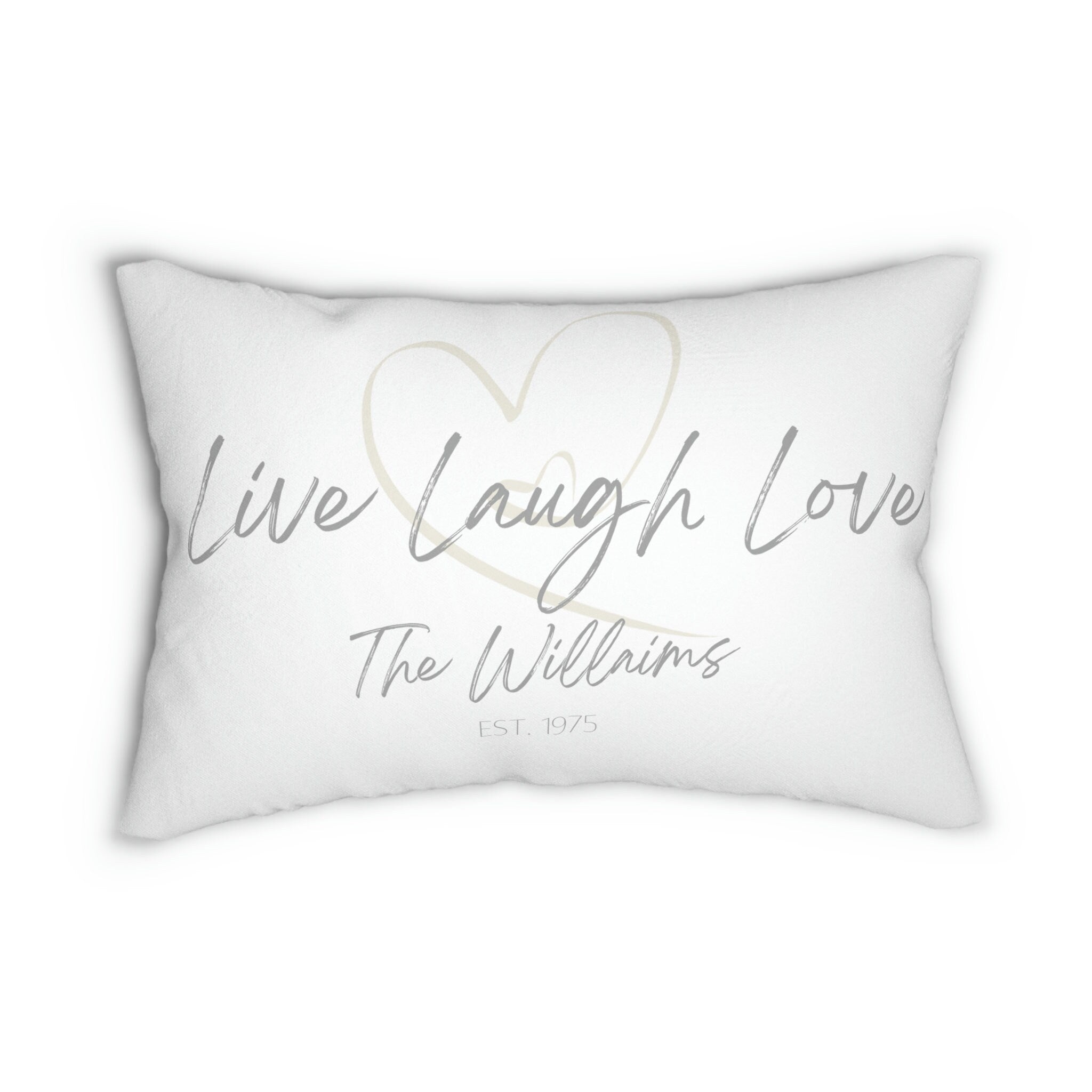 Personalized Live Laugh Love lumbar pillow on white distressed wood chair in bright room