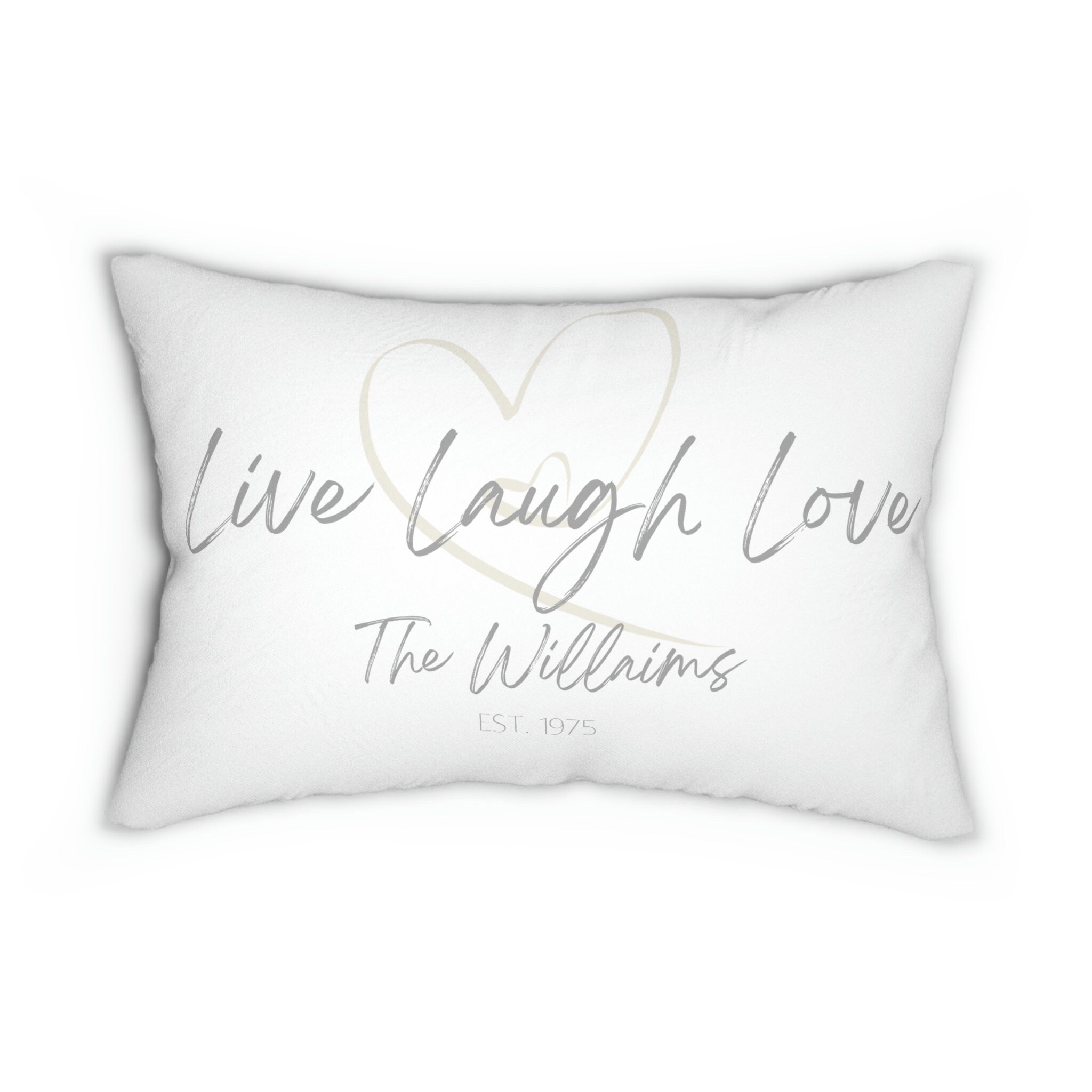 Personalized Live Laugh Love lumbar pillow on white distressed wood floor beside galvanized milk jug with fringe blanket