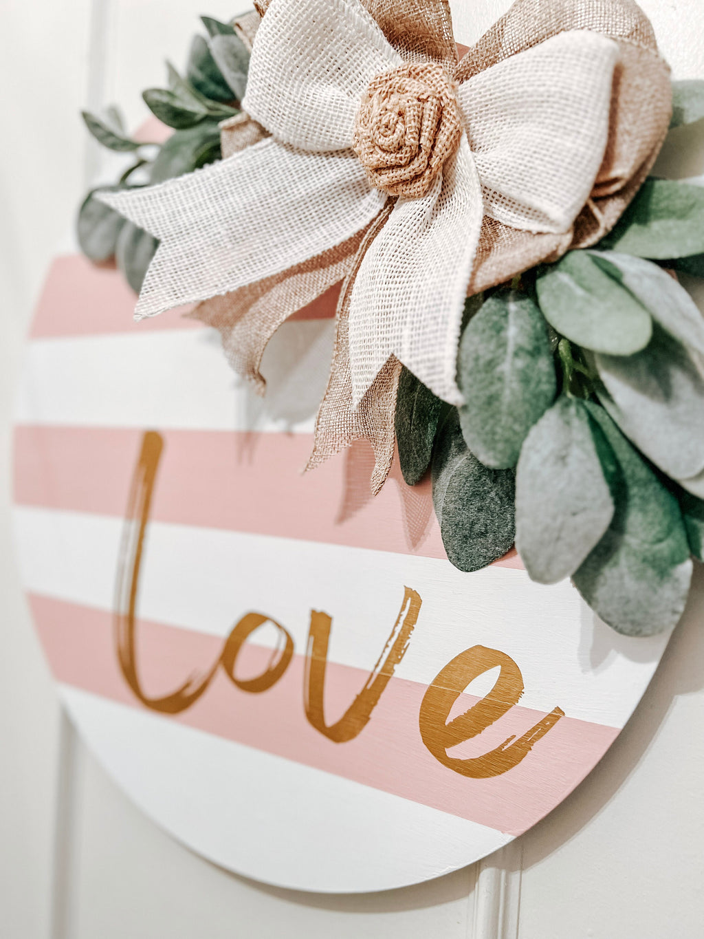 Valentine Love door hanger close-up with burlap bow and greenery