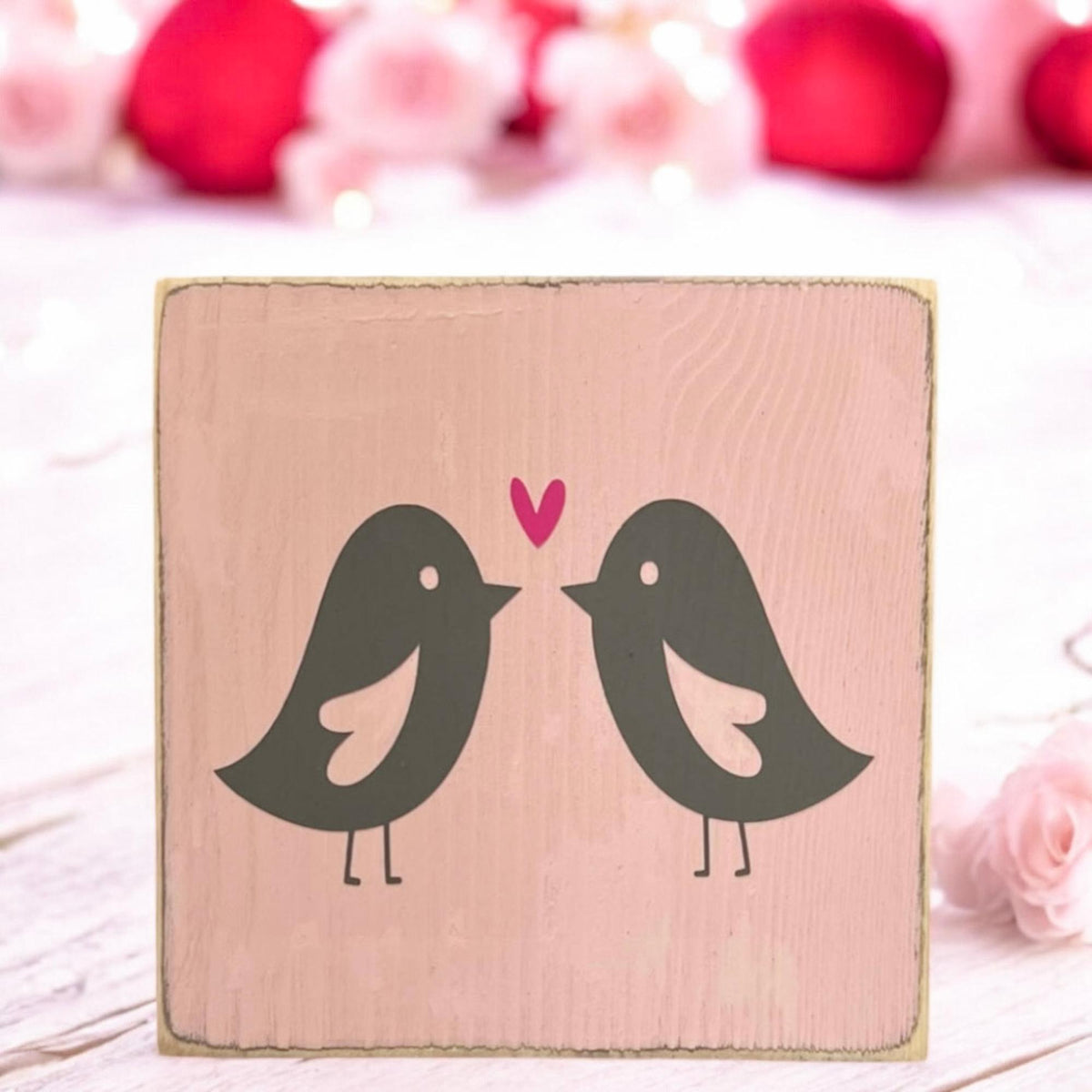 Lovebirds Valentine wood block sign on wicker tray with pink flowers in kitchen setting