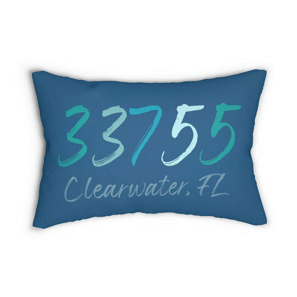 Personalized 33755 Clearwater FL navy lumbar pillow on leather sofa with rust throw pillow close up