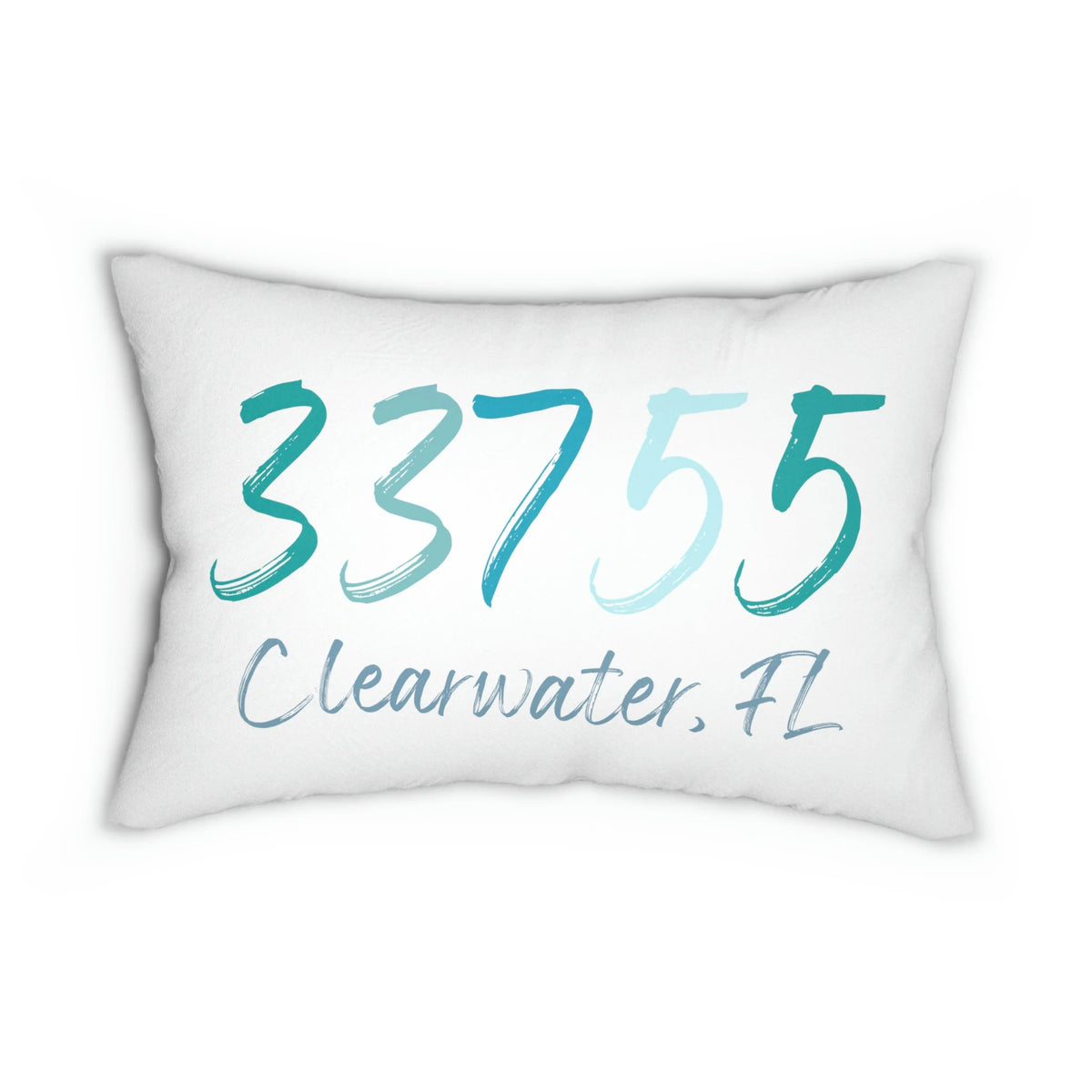 Personalized zip code lumbar pillow reading 33755 Clearwater FL in coastal teal blues on white distressed wood chair