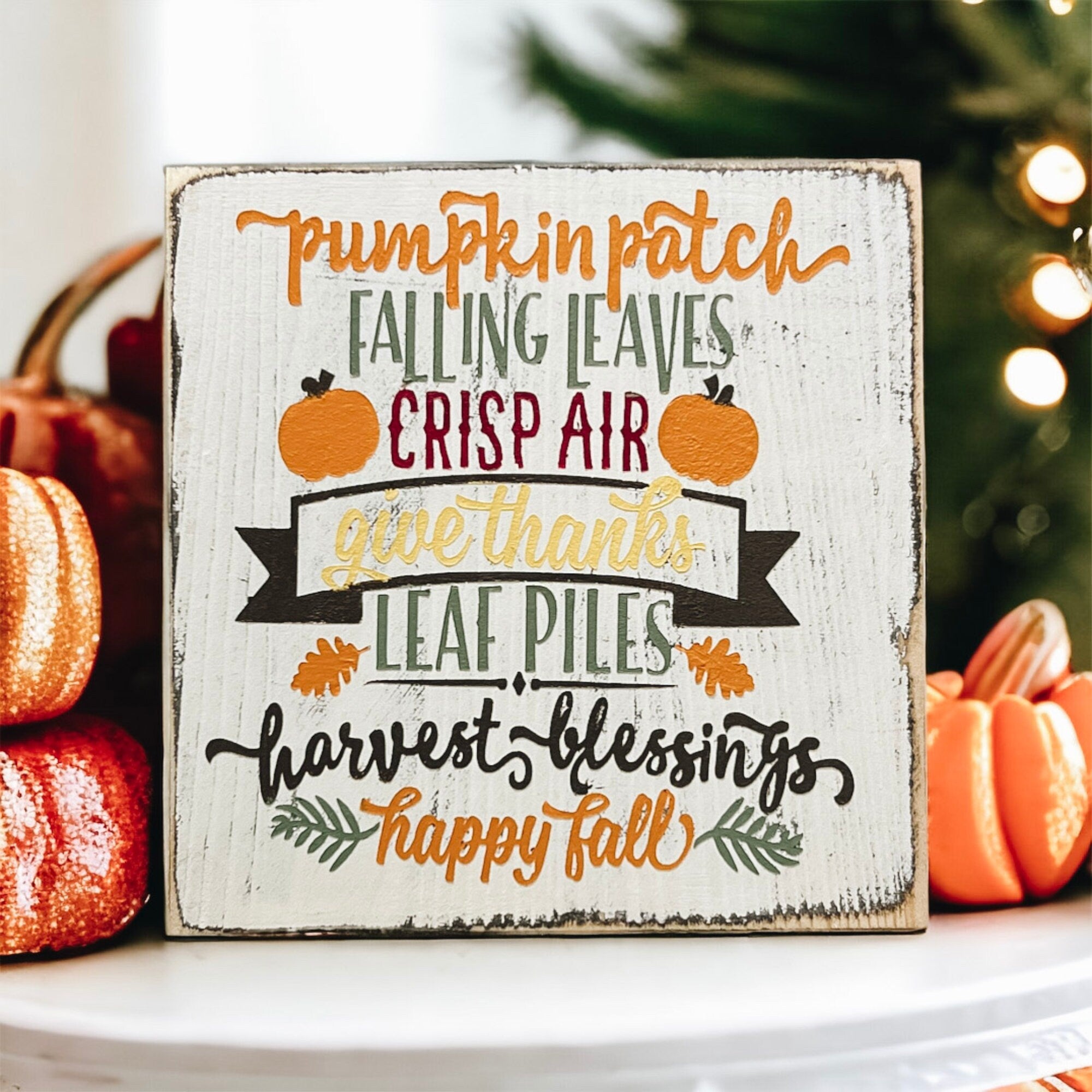 Fall sign close up showing multicolor lettering with pumpkin patch and harvest blessings