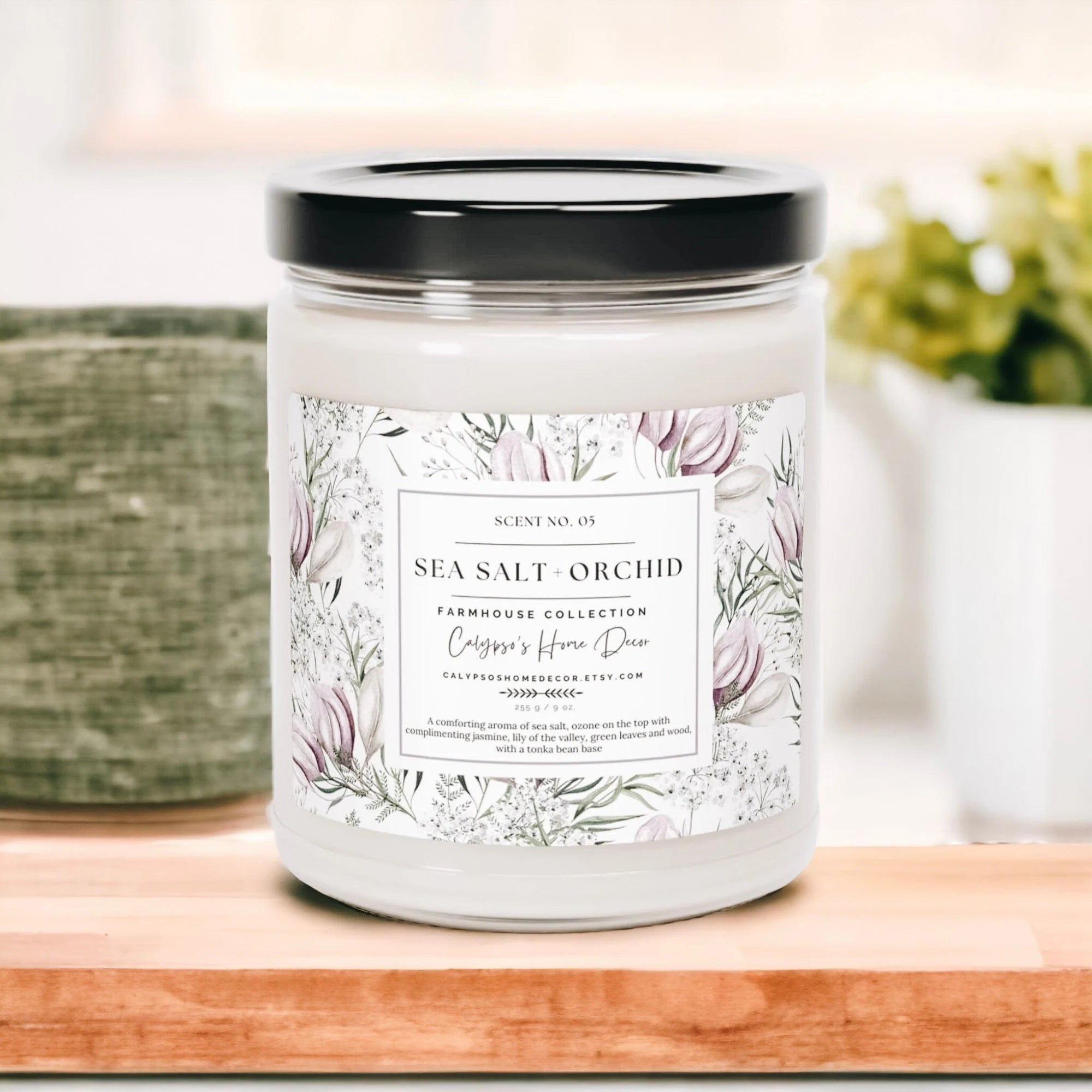 Sea Salt Orchid candle on wood surface with soft natural light