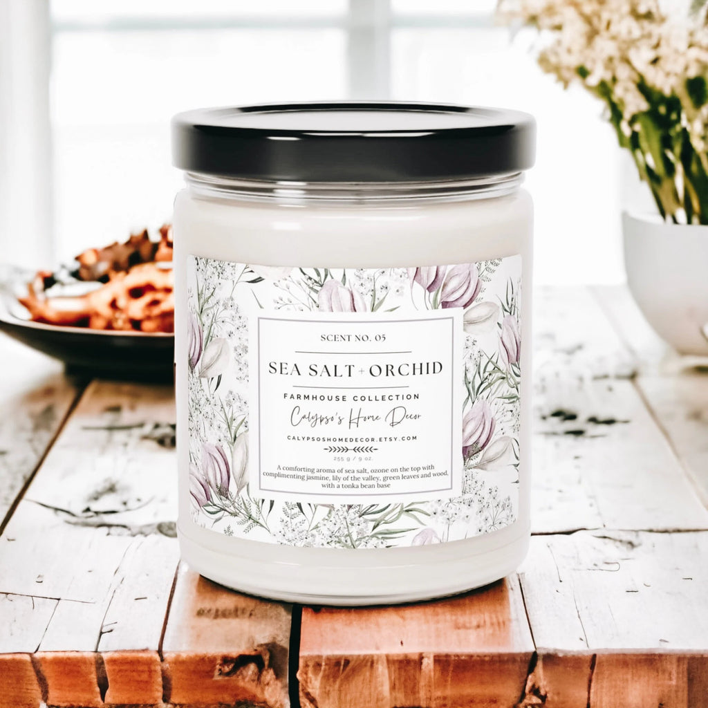 Sea Salt Orchid candle on rustic wood dock with sandy beach and starfish in background