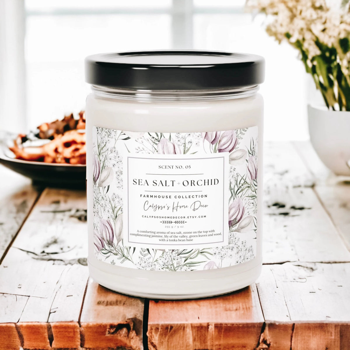 Sea Salt Orchid candle on rustic wood dock with sandy beach and starfish in background