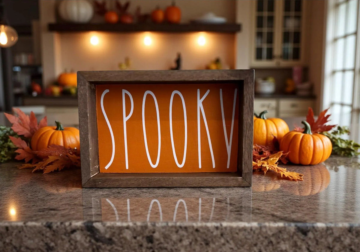 Spooky sign front view on dark wood with pumpkins