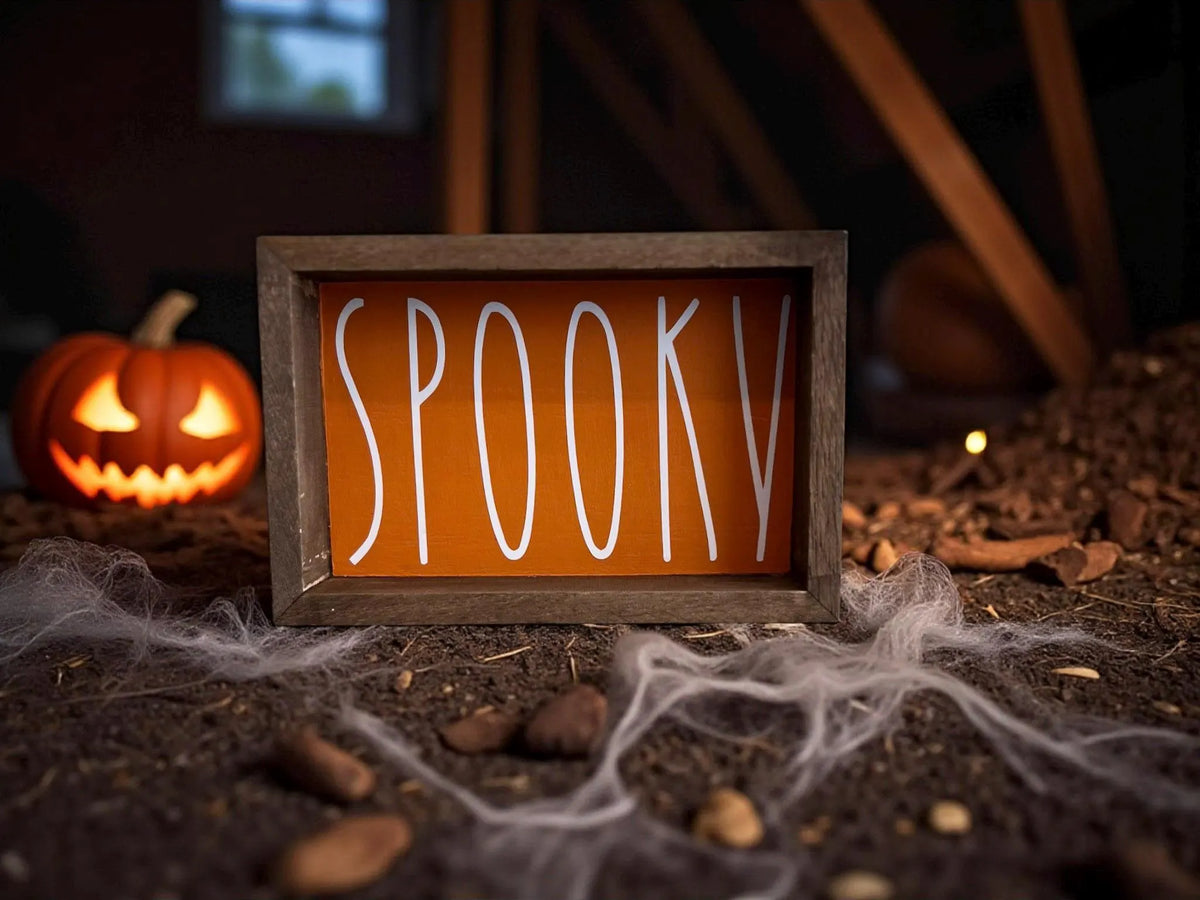 Spooky sign on farmhouse kitchen shelf with pumpkins and fall decor