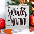 Sweater Weather 5x5 wood sign with pumpkins and bokeh lights