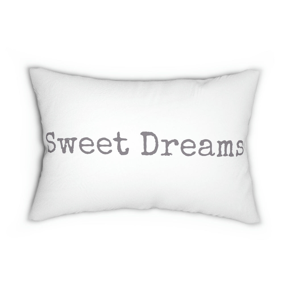 Sweet Dreams white lumbar pillow with gray distressed typewriter lettering on cream upholstered sofa lifestyle shot