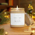 Vanilla Bean candle on shelf next to books and succulent plant with warm ambient light