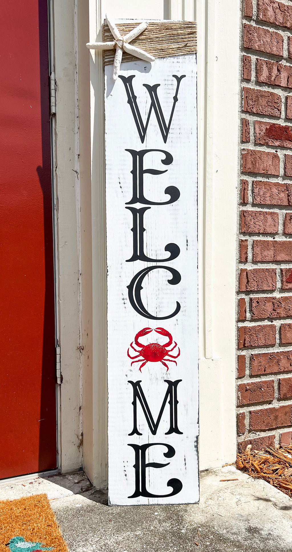 Crab Welcome porch leaner close-up of L C lettering with red crab accent