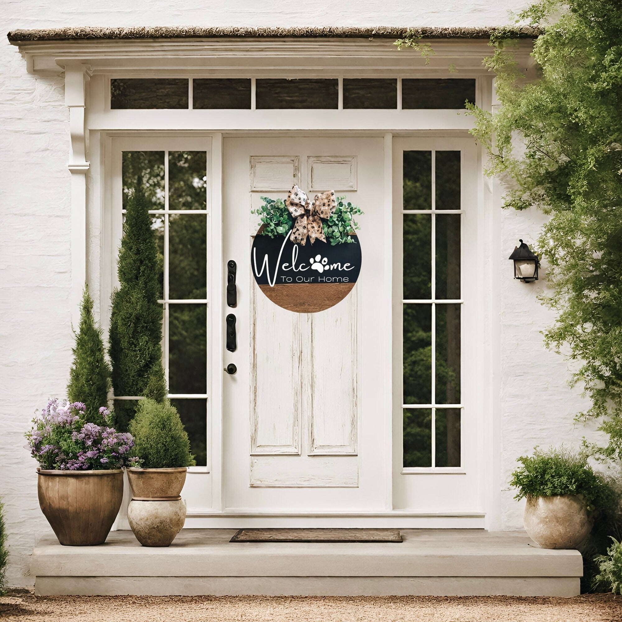 Welcome To Our Home door hanger styled on white shelf with basket