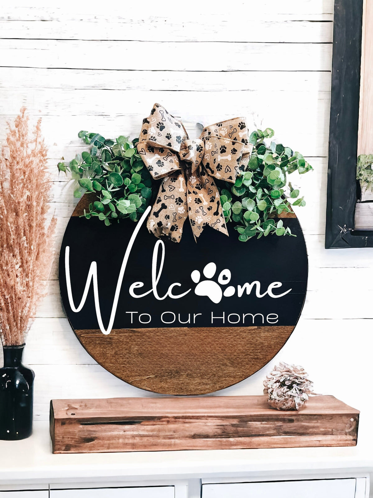 Welcome To Our Home door hanger on white door with garden planters