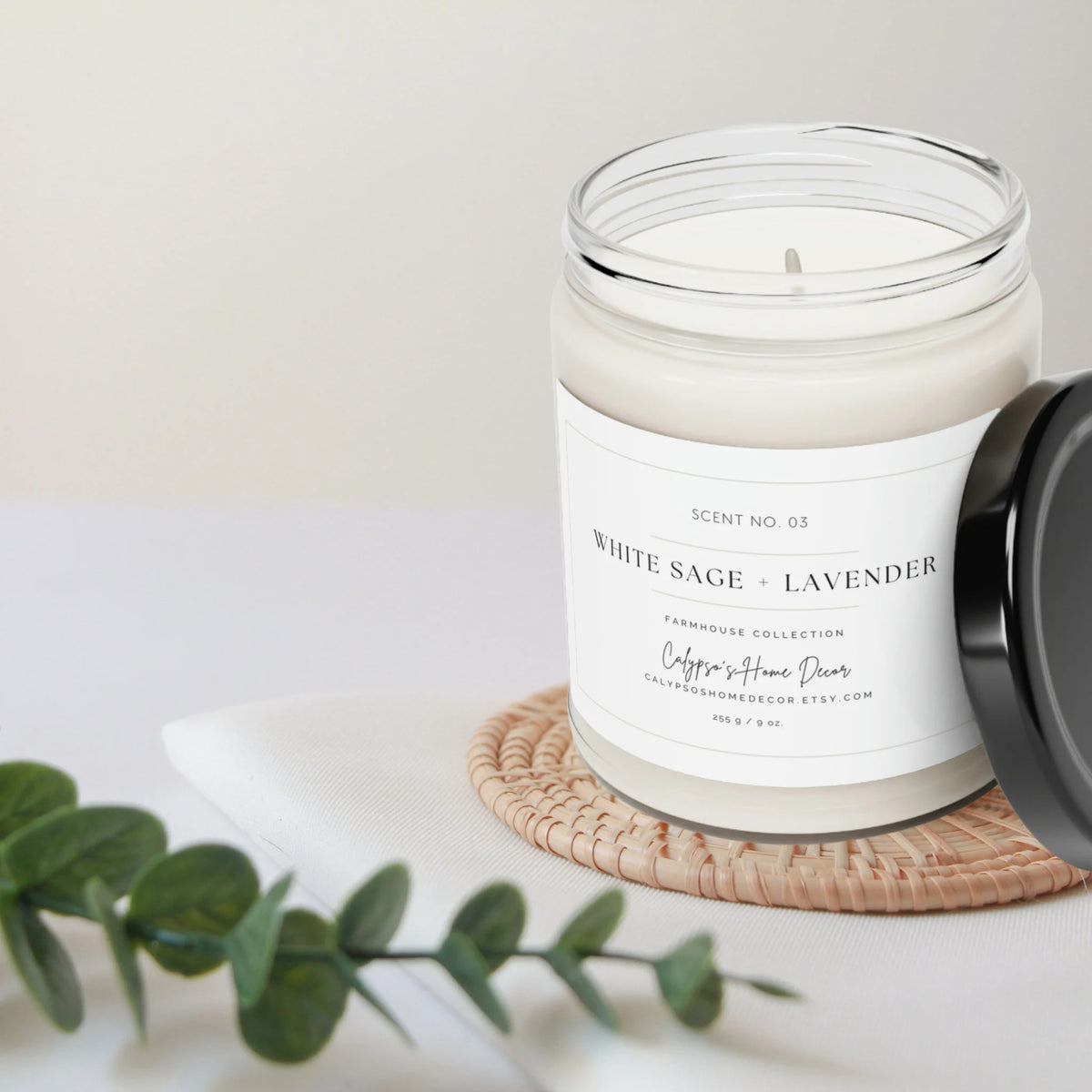 White Sage + Lavender soy candle Scent No. 03 in clear glass jar with black lid product shot on white background front view