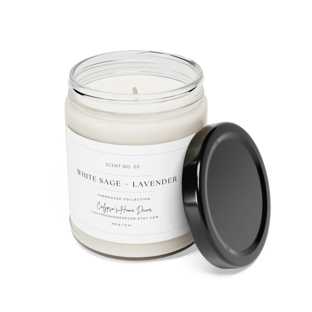 White Sage + Lavender soy candle Scent No. 03 in clear glass jar with black lid on rattan trivet with eucalyptus sprig on cream background lifestyle shot